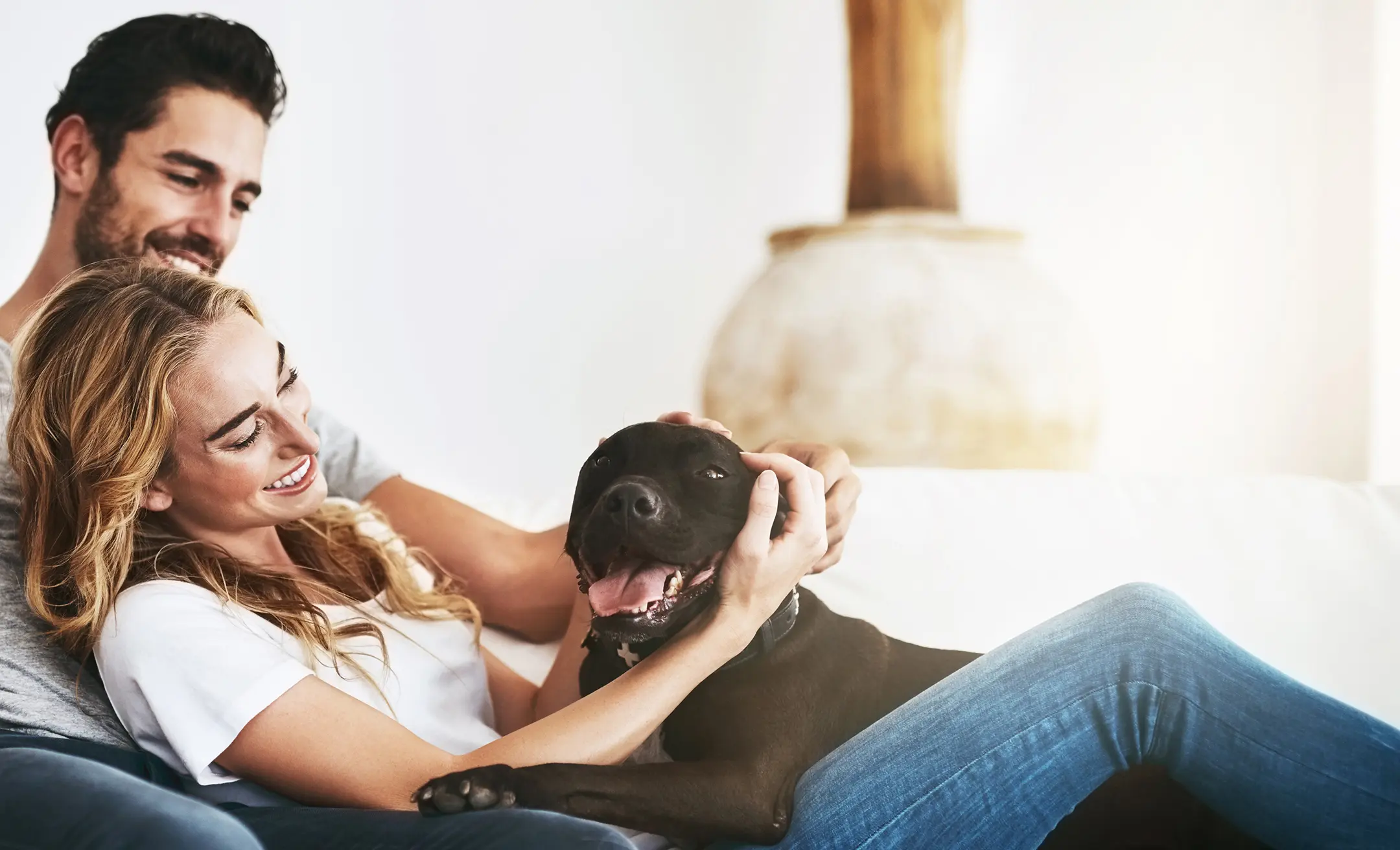 home-couple on couch-nebula heating and cooling-winter haven