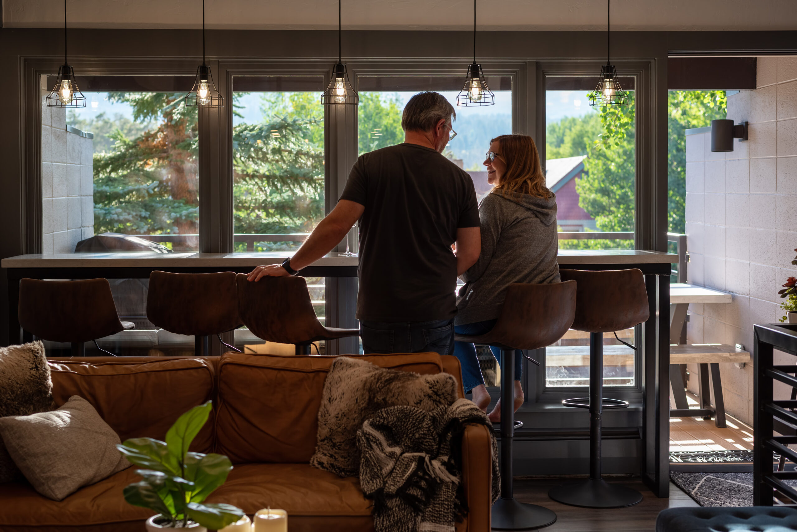 Candid backview of middle age couple relaxing at home