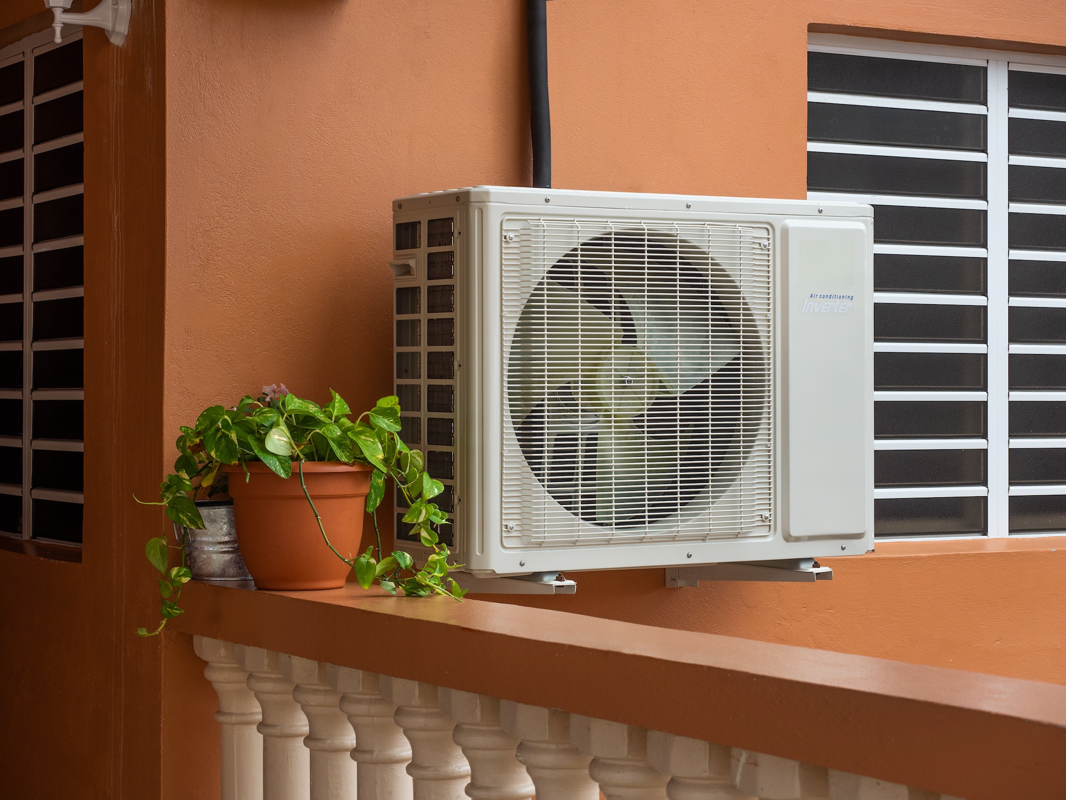 High efficiency modern AC-heater inverter unit, energy save solution-horizontal, outside a residential home