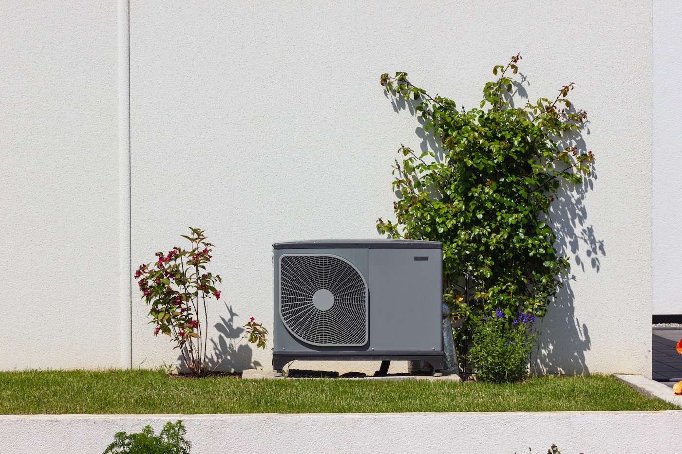 heat pump in a new building area with modern house facades of south germany on a sunny day in springtime